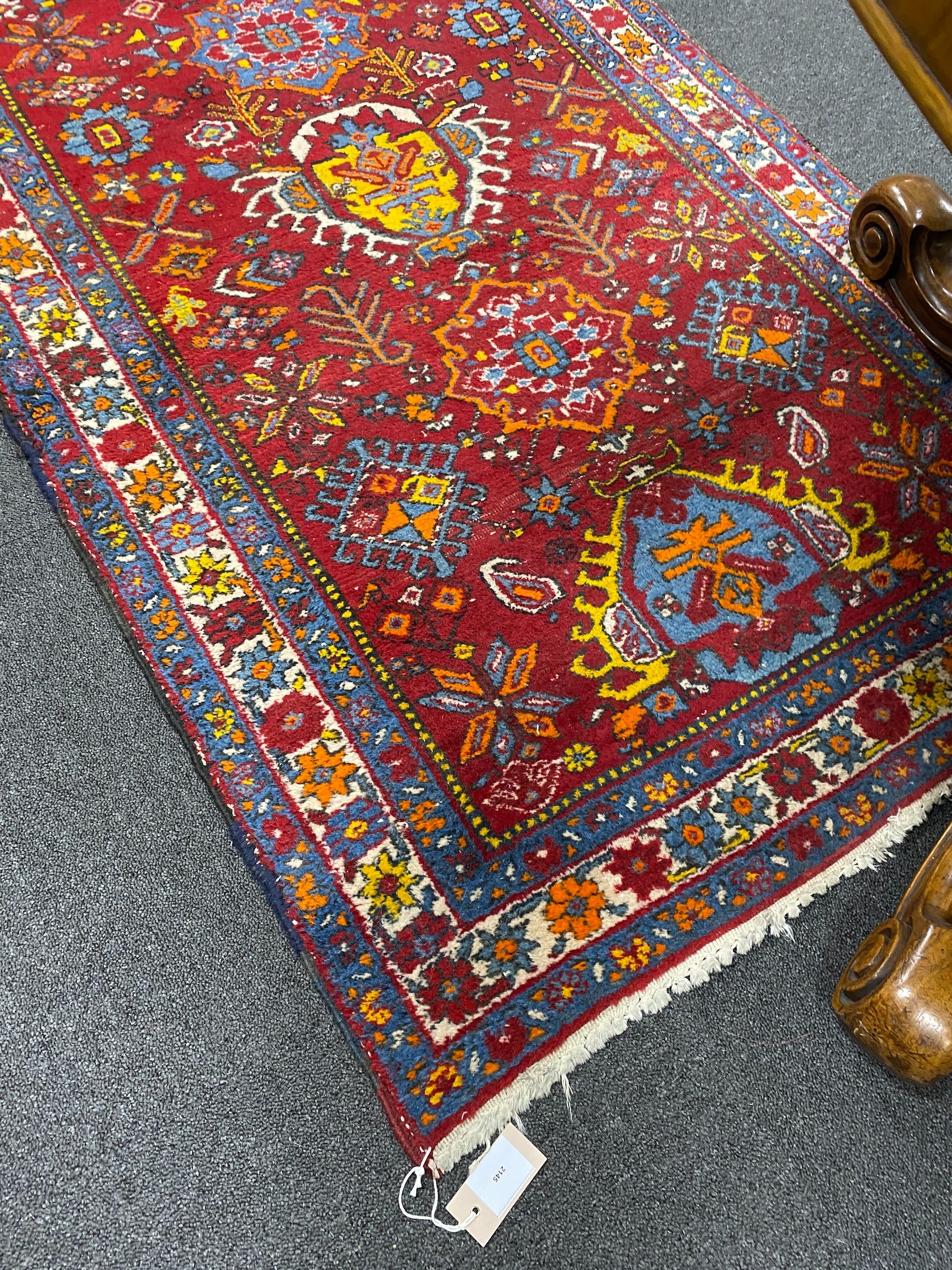 A North West Persian red ground runner, 426 x 100cm